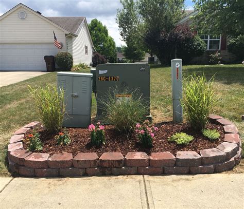 how to hide electrical box in front yard|underground utility box hack.